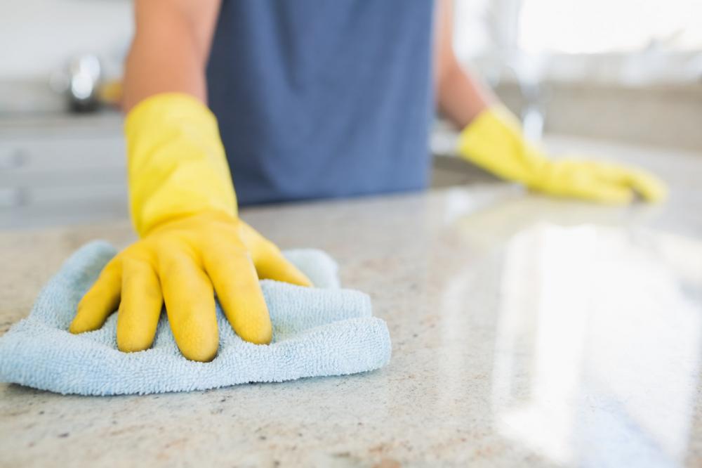 woman-cleaning-the-counter